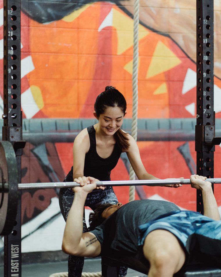A fitness coach training a client